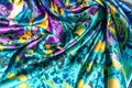 Texture, fabric, background. Women's scarf. Silk fabric is blue,