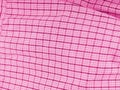 The texture of the fabric is in the form of a pink cell with iridescences. Almost flat Royalty Free Stock Photo