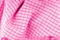 The texture of the fabric in the form of a pink cell with iridescences Royalty Free Stock Photo
