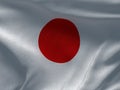 Texture of a fabric with the image of the flag of Japan, waving in the wind. Royalty Free Stock Photo