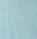 The texture of the fabric is light blue terry towel. Terry cloth as a background. Royalty Free Stock Photo