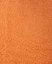 The texture of the fabric is orange terry towel. Terry cloth as a background. Royalty Free Stock Photo