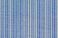 A close up of woven synthetic material texture; blue colour, background image. Royalty Free Stock Photo