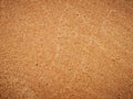 Texture of fine golden coastal sand. Lines in the sand of a beach. Royalty Free Stock Photo