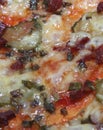 The texture of the finished pizza is the texture of the top layer with melted cheese and smoked sausage. The process of cooking a