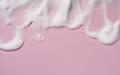 Texture of the foam of the skin care cleanser. Soap bubbles with copy space on pink background Royalty Free Stock Photo