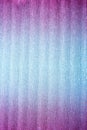 Texture of folded metallic crepe paper colored in pink to blue neon gradient Royalty Free Stock Photo