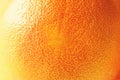 Texture of fresh bright orange peel, closeup, copy space. Macro of orange fruit. Citrus fruit background Royalty Free Stock Photo