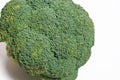 Texture fresh green head of broccoli close-up on white background, top view. Royalty Free Stock Photo