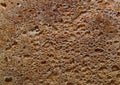 Texture of fried crust on a loaf of bread of home baking