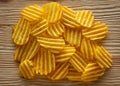 Texture fried golden brown potato chips, close-up