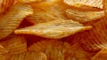 Texture fried golden brown potato chips, close-up