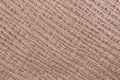 Texture of genuine grainy leather close-up, color of porous milk chocolate. Fashionable modern background, copy space