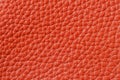 Texture of genuine leather close-up, cowhide, orange. For natural, artisan backgrounds, backdrop, substrate composition Royalty Free Stock Photo