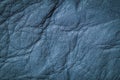 Texture of genuine leather close-up, surface close-up with wrinkles and cracks, blue color print, trendy background Royalty Free Stock Photo
