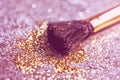 Texture of gold glitter on the makeup brush