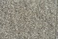 Texture of granite concrete stone wall in sunlight for pattern, background or 3D. Horizontal, close up Royalty Free Stock Photo