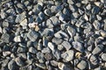 The texture of granite crushed stone close-up. Crushed stone abstract textured background Royalty Free Stock Photo