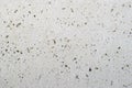 Texture of a gray concrete wall with small depressions