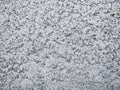 Texture of a gray concrete wall scatter of small crumbs