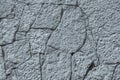 Texture of gray silvery color stone wall with cracks