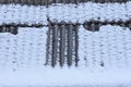 texture of gray slate on the roof of a house in white snow Royalty Free Stock Photo