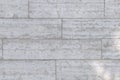 The texture of a gray stone wall made of rectangular marble blocks. Royalty Free Stock Photo