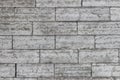 The texture of a gray stone wall made of rectangular marble blocks Royalty Free Stock Photo