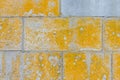The texture of a gray stone wall with a yellow paint Royalty Free Stock Photo