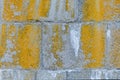 The texture of a gray stone wall with a yellow paint Royalty Free Stock Photo