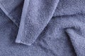 Texture of a gray terry towel with edged edge closeup. Home textiles