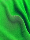 The texture of the green cloth is wavy. Abstract background with striped pattern. Royalty Free Stock Photo