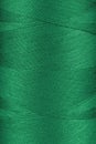 Texture of green color threads in spool close up, macro Royalty Free Stock Photo