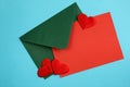 Texture green envelope with red blank sheet with hearts Royalty Free Stock Photo