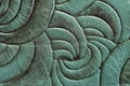 Texture of green mint genuine leather close-up, with embossed twirl curve, spiral trend pattern. Fashionable background Royalty Free Stock Photo