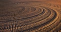 Texture of ground with traces of the tractor. Plowed field