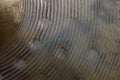 Texture of heavily used bronze hand hammered hihat cymbal