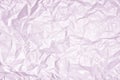 Texture of heavily wrinkled light lilac paper. Empty background.