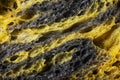 Texture of homemade slice of sourdough freshly baked bread on white background, activated carbon, pumpkin and curcuma spice