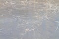 The texture of ice on a river or lake in winter with traces and stripes from the blades of skates Royalty Free Stock Photo