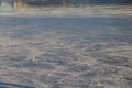 The texture of ice on a river or lake in winter with traces and stripes from the blades of skates Royalty Free Stock Photo