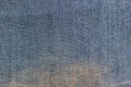 Texture of the inner side of a blue denim fabric with the big yellow stain Royalty Free Stock Photo