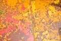 Texture of iron metal painted multicolored red yellow peeling paint of old battered scratched cracked ancient rusty metal sheet Royalty Free Stock Photo