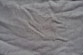 Texture of jammed grey fabric from above