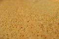 Texture of the just brewed coffee foam of aromatic Italian Espresso, selective focus