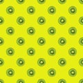 texture. Kiwi repeating seamless pattern on yellow background. Kiwi is cut.