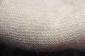 The texture of the knitted product. Downy shawl. Fleece. Natural product. Element of clothes.