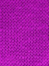 Texture of knitted wool fabric with of a pink color. Close-up. Selective focus Royalty Free Stock Photo