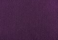 The texture of knitted woolen fabric purple. Royalty Free Stock Photo