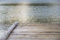 Texture lake, nature. Wooden pier. Cloudy day, waves.Texture lake, nature. Cloudy day, waves.